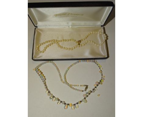 A modern necklace of graduated water opal drops and round beads and a necklace of uniform cultured pearls, (boxed), (2). 