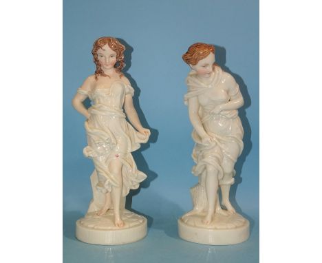 A pair of Royal Worcester gloss ivory porcelain figures with painted limbs and faces modelled by James Hadley, depicting 'Bef