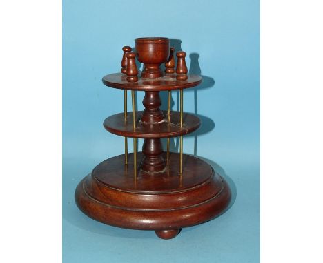 An antique turned wood bobbin holder, 22cm high. 