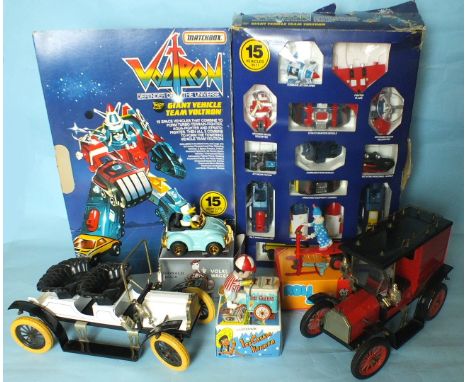 Matchbox, 'Voltron, Defender of the Universe' Set, boxed, two diecast large-scale vintage cars and three boxed tinplate toys.