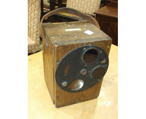 A Morse code key and light signalling device in wooden box, marked W H Stone & Co, Cardiff.