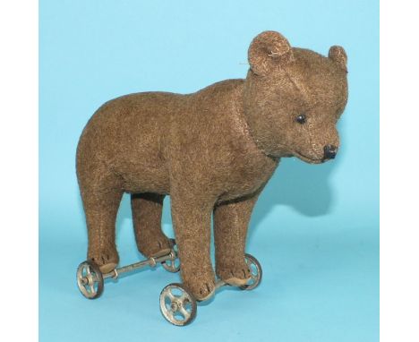 Steiff, between the wars (1925-1935) pull-along bear on wheels, covered in brown tweed, with swivel head, black button eyes, 