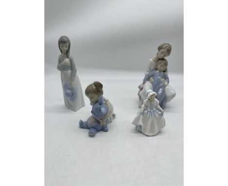 Three NAO Porcelain and One Royal Doulton Porcelain Figurines. 
Good condition, no damage. 