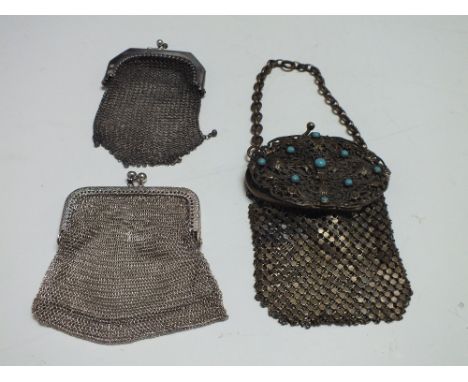 THREE VINTAGE LADIES MESH COIN PURSES, to include a chatelaine example and a larger example with a decorative filigree top se