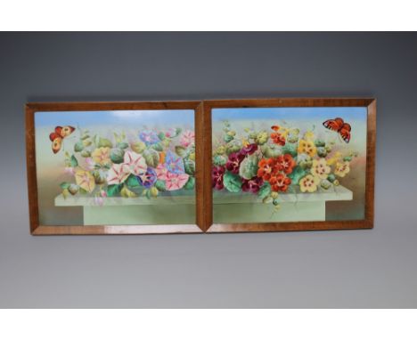 A PAIR OF EARLY 20TH CENTURY CERAMIC PANELS WITH PAINTED DECORATION, depicting flowers and butterflies, wooden framed, 17.7 x