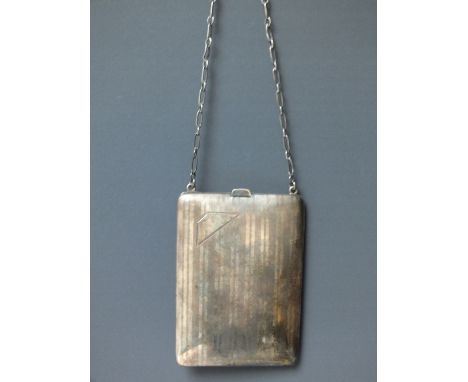 A HALLMARKED SILVER LADIES COMBINATION COMPACT, marked as 'Sterling', having white metal chain, the interior fitted with mirr