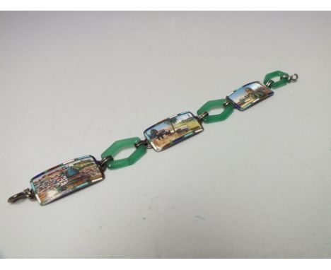 AN ART DECO EGYPTIAN REVIVAL SILVER ENAMEL PANEL LINK BRACELET, the picturesque panels interspersed with geometric uranium gl