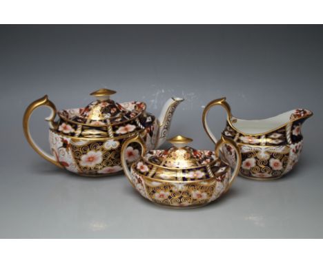 A ROYAL CROWN DERBY IMARI THREE PIECE TEA SERVICE, all in 2451 pattern with the teapot and sugar bowl both carrying date code