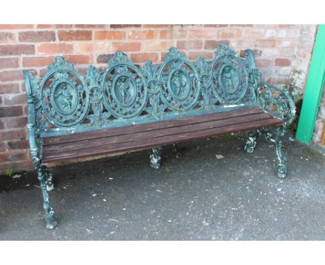 A 'FOUR SEASONS' CAST GARDEN BENCH, with wooden seat, approximate dimensions: W 183 cm, D 66 cm, H 86 cm, in the manner of Ma