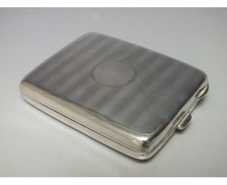 A HALLMARKED SILVER CIGARETTE CASE - BIRMINGHAM 1919, makers mark for H.W., gilt interior with sprung divisions, engine turne