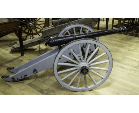 A HALF SIZE SCALE MODEL OF A 19TH CENTURY FIELD GUN ON CARRIAGE, the tapering barrel formed in five sections, with raised ban