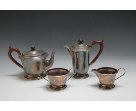 A HALLMARKED SILVER ART DECO STYLE FOUR PIECE TEA AND COFFEE SERVICE - BIRMINGHAM 1938, each on a stepped footed base, makers