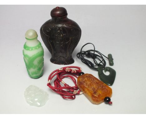 TWO ORIENTAL CARVED PERFUME BOTTLES, together with a selection of Oriental jewellery items to include a jade Buddha pendant (