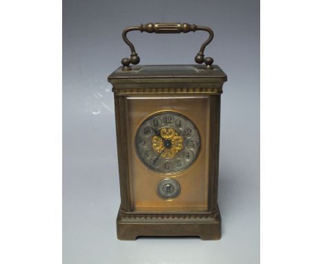 A MINIATURE BRASS CASED CARRIAGE CLOCK, the silvered dial with Arabic numerals, subsidiary alarm dial below, H 15 cm (inc. ca