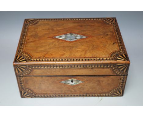 AN EARLY 20TH CENTURY INLAID SEWING BOX, having central diamond shaped mother of pearl cartouche to the lid and similar escut