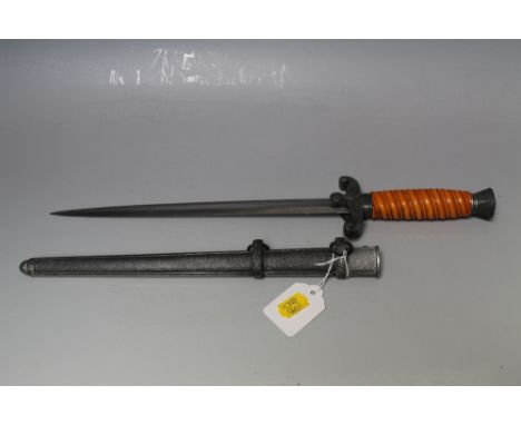 A NAZI STYLE WEHRMACHT DAGGER IN SCABBARD, bearing mark on blade and W.K.C. Solingen, blade length 326 cm