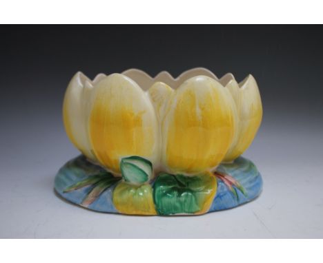 A CLARICE CLIFF BOWL IN THE FORM OF A WATER LILY, printed marks for Newport pottery to base, shape No.973, W 22.5 cm, H 12.6 