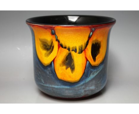 A CONTEMPORARY POOLE POTTERY JARDINIERE, blue ground with floral decoration, makers marks to base, Dia. 19.5 cm, H 16.5 cm