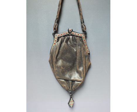 A VINTAGE LEATHER ART DECO EVENING BAG WITH WRIST STRAP, satin lined with original attached mirror, the frame with red rhines