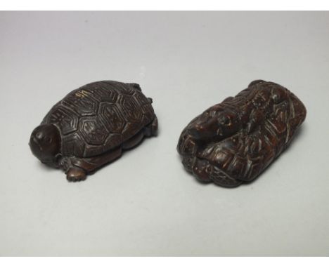 A CARVED WOODEN SIGNED NETSUKE IN THE FORM OF A TURTLE WITH ORIENTAL MAN TO UNDERSIDE, together with another signed netsuke i