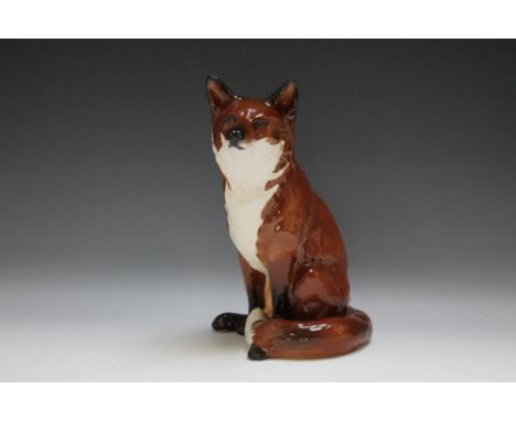 A BESWICK FIRESIDE MODEL OF A SEATED FOX, model number 2348, impressed and printed marks to base, H 31 cm