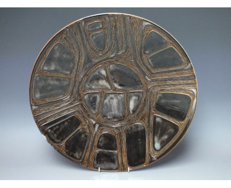 A LARGE POOLE STUDIO POTTERY CHARGER WITH INCISE DECORATION, brown tonal glaze, painted marks to base, Dia. 41 cm