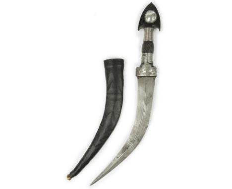 A Marsh Arab dagger (jambiya), curved blade 9 in. with narrow medial rib, polished horn hilt with white metal mountings and a