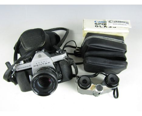 A vintage pair of Canon 3X sports glasses together with a Pentax Spotmatic F camera