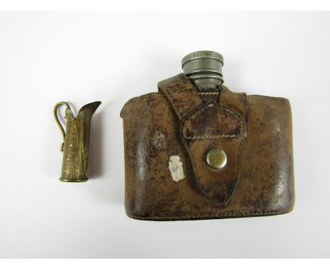 A First World War trench art miniature jug fabricated from a .303 rifle cartridge case together with a pewter hip flask