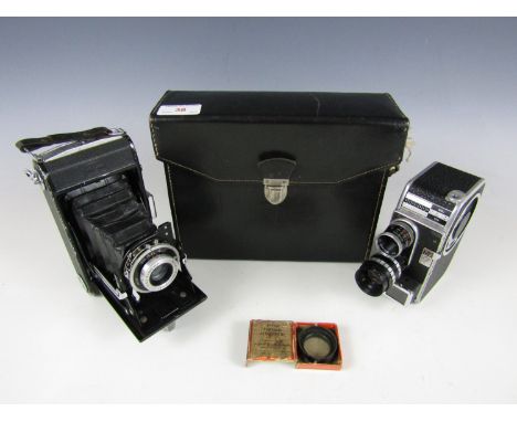 A cased Bolex Paillard 8sl Swiss film camera together with a Zeiss Ikon camera and a boxed Kodak Portrait attachment