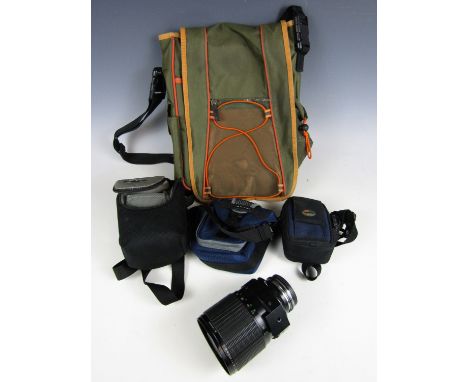 A Sigma mirror telephoto lens (a/f) together with four camera bags