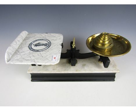 A Bartlett & Son Ltd set of balance scales with weights