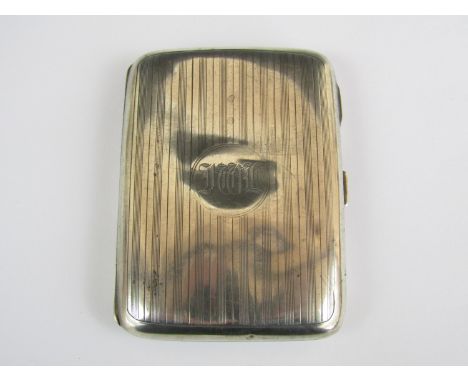 An engine turned silver cigarette case