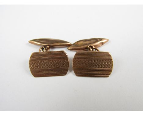 A pair of 9ct gold cuff links, with engine turned decoration, 3.7g