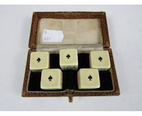 A vintage cased set of poker dice