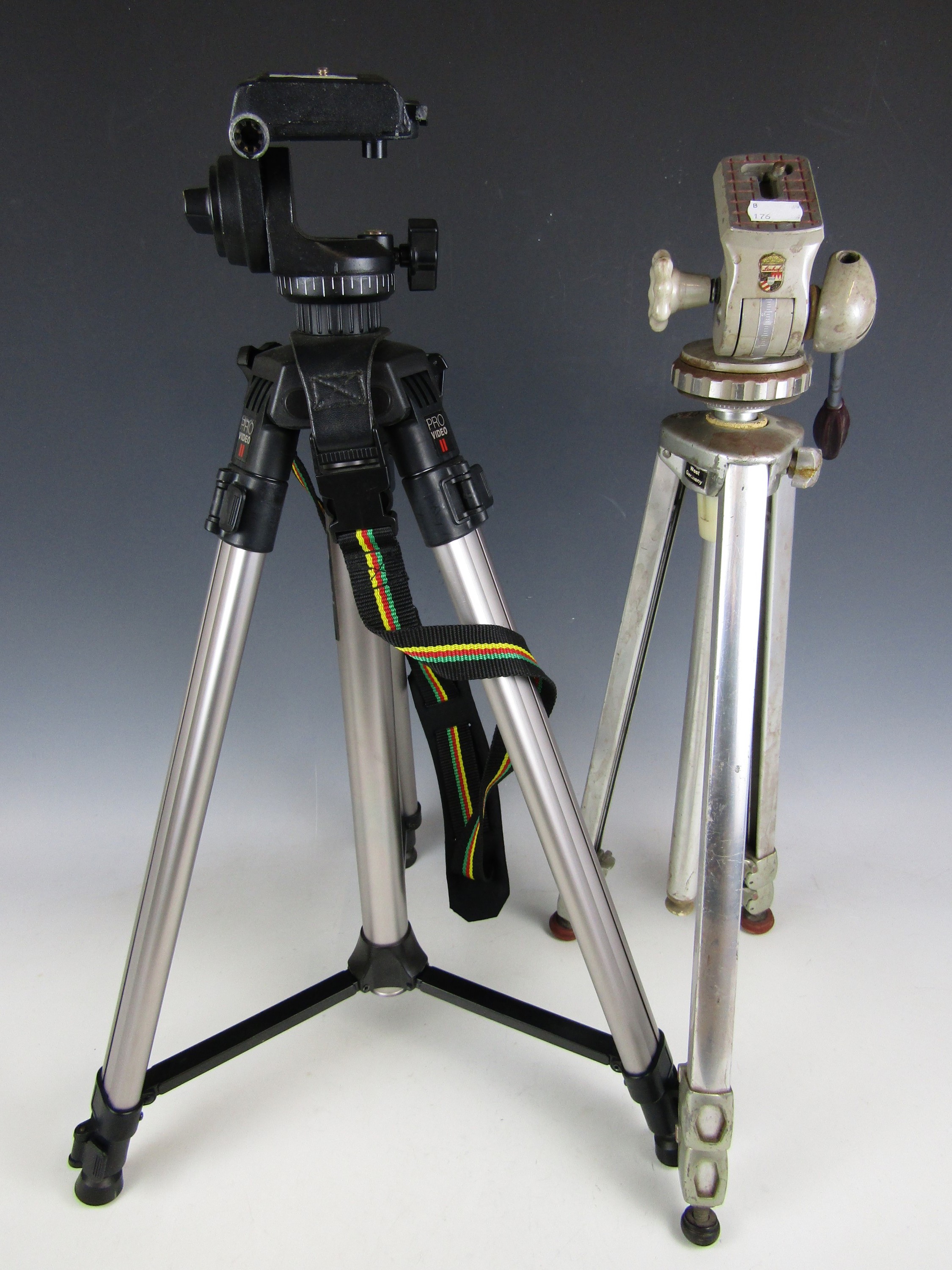 Two vintage camera tripods including a Linhof and a Pro Video