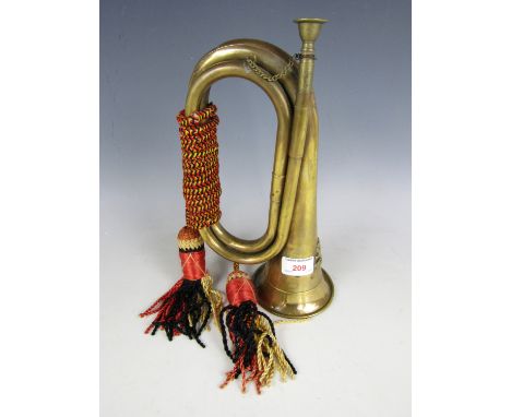 A brass bugle with tassels