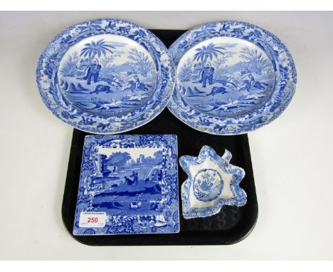 A Spode Italian ware teapot stand together with two early 19th Century blue and white transfer printed Indian Bear Hunt patte