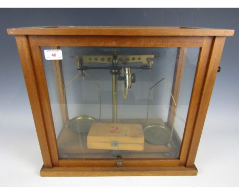 A cased set of beam scales with weights
