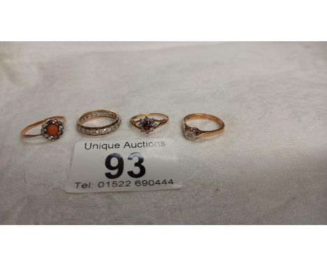 A diamond single stone gold ring, a gold band ring and two other vintage rings, assorted stones.