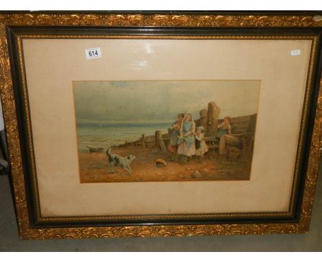 An early 20th century framed and glazed print featuring children on a beach, 88 x 65 cm.