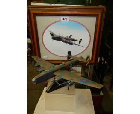 A model of a Lancaster bomber and a Lancaster print.