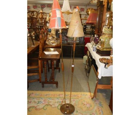 A retro twin light standard lamp with original shades.The base is made of cast iron with a wood grain finish.All Brass parts 