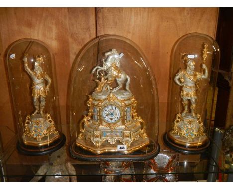 A magnificent French clock garniture under glass domes.&nbsp; The clock surmounted a horse with handler, the sidepieces being