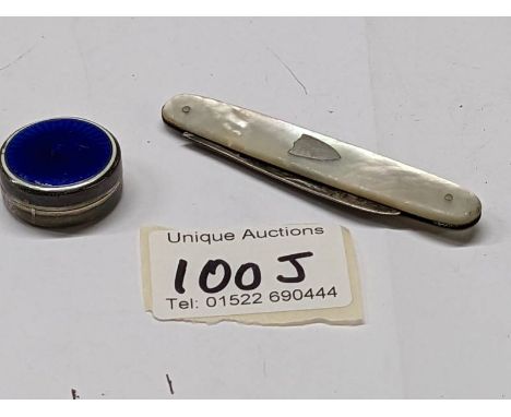 A silver and enamel pill box and a silver and mother of pearl pen knife.