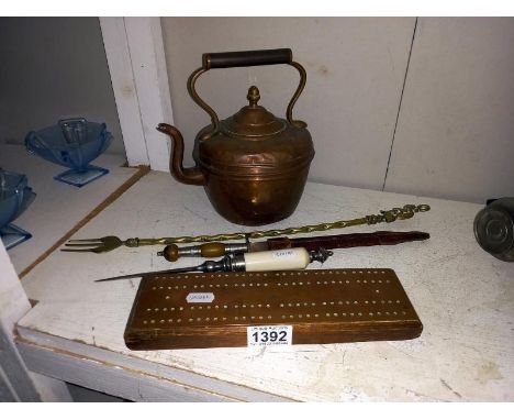 A copper kettle, 2 letter openers, a toasting fork &amp; cribbage board