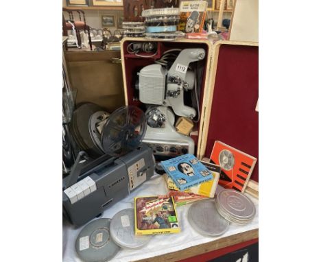 A cased film projector  and a boxed projector and a qty of films