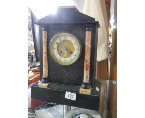 A black slate/marble mantel clock.