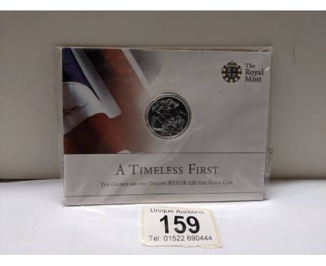 An uncirculated Timeless first George and the dragon 2013 UK £20 fine silver coin.