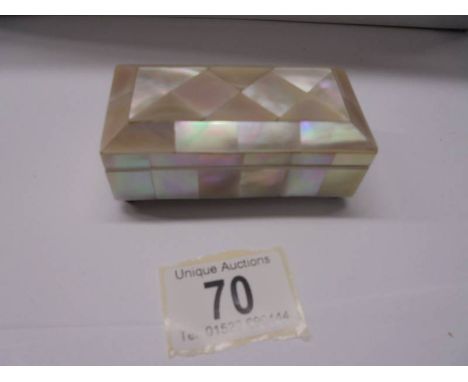 A three section mother of pearl stamp box.